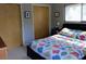 Bedroom featuring a comfortable bed, side tables with lamps and two closets at 307 Druid Hills Rd, Temple Terrace, FL 33617
