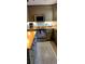 Kitchen showcasing wood cabinetry, butcher block counters, and stainless steel appliances at 307 Druid Hills Rd, Temple Terrace, FL 33617