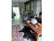 Inviting living room with stylish furniture, a vibrant rug, and a view into the dining area at 307 Druid Hills Rd, Temple Terrace, FL 33617