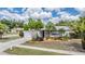 Well-maintained home featuring a green lawn and established landscaping at 3230 Player Dr, New Port Richey, FL 34655
