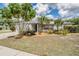 Charming single-story home with a well-manicured lawn and attractive landscaping at 3230 Player Dr, New Port Richey, FL 34655