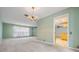 Bright living room offering open access to kitchen and dining area for seamless entertaining at 3230 Player Dr, New Port Richey, FL 34655