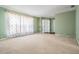Spacious living room with neutral carpet, large windows and a view, offering a welcoming atmosphere at 3230 Player Dr, New Port Richey, FL 34655