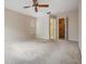Spacious main bedroom features neutral walls, carpet flooring and closet space at 3230 Player Dr, New Port Richey, FL 34655