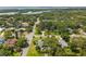 Aerial view of a residential neighborhood featuring mature trees and well-maintained homes at 3236 San Pedro St, Clearwater, FL 33759