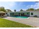 Beautiful backyard featuring a private pool, lounging area, and a well-maintained lawn at 3236 San Pedro St, Clearwater, FL 33759