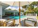Backyard pool featuring lounge chairs, a playhouse, and covered outdoor seating area at 3236 San Pedro St, Clearwater, FL 33759