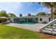 Spacious backyard featuring a private pool, well-manicured lawn, and relaxing outdoor seating areas at 3236 San Pedro St, Clearwater, FL 33759