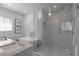 Bright bathroom featuring a standalone tub, glass-enclosed shower, and elegant tile work at 3236 San Pedro St, Clearwater, FL 33759