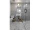 Stylish bathroom featuring patterned tile, a glass-enclosed shower, and modern fixtures at 3236 San Pedro St, Clearwater, FL 33759