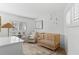 Cozy Bedroom with a wooden crib, comfortable seating, and soft natural lighting at 3236 San Pedro St, Clearwater, FL 33759