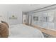 Bright bedroom with wood floors, neutral colors, and large windows allowing ample natural light at 3236 San Pedro St, Clearwater, FL 33759