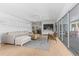 Bright living room with views of the pool, hardwood floors, and modern design at 3236 San Pedro St, Clearwater, FL 33759