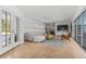Spacious living room showcasing natural light, modern decor, and seamless indoor-outdoor flow at 3236 San Pedro St, Clearwater, FL 33759