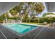 Gorgeous pool area with brick pavers, lush landscaping, and a charming playhouse for outdoor fun at 3236 San Pedro St, Clearwater, FL 33759