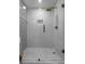 Modern shower with subway tile, glass enclosure, and bronze fixtures at 3236 San Pedro St, Clearwater, FL 33759
