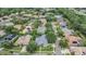 Aerial view of the neighborhood, highlighting the home, mature trees and greenery at 3727 Janus Way, Palm Harbor, FL 34685