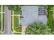 Birds eye view of the home highlighting roof, landscaping, and pool at 3727 Janus Way, Palm Harbor, FL 34685