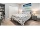 Comfortable bedroom with a nautical theme, featuring a full bed, and a large closet at 3727 Janus Way, Palm Harbor, FL 34685