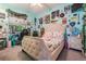 Comfortable bedroom with a bed, gaming setup, and decorated with posters at 3727 Janus Way, Palm Harbor, FL 34685