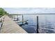 Dockside view of a wooden boat dock, providing residents access to the beautiful lake at 3727 Janus Way, Palm Harbor, FL 34685