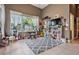 Bonus room features a large window, musical instruments, tv, and bookshelves at 3727 Janus Way, Palm Harbor, FL 34685