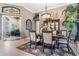 Stylish dining room showcasing a wooden table set, a china cabinet, and a view into the office space at 3727 Janus Way, Palm Harbor, FL 34685