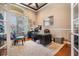 Cozy home office with wooden floors, lots of light, and modern desk setup, ideal for remote work at 3727 Janus Way, Palm Harbor, FL 34685