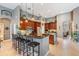 A spacious kitchen features dark wood cabinets, stainless steel appliances, and granite countertops at 3727 Janus Way, Palm Harbor, FL 34685