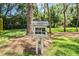 Charming Little Free Library providing complimentary reading material, promoting community literacy within a serene natural setting at 3727 Janus Way, Palm Harbor, FL 34685