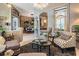 Comfortable living room with plush seating, stylish decor, and an open layout into the dining area at 3727 Janus Way, Palm Harbor, FL 34685