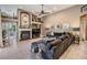 A comfortable living room offers a fireplace, high ceilings, and tile floors at 3727 Janus Way, Palm Harbor, FL 34685