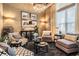 Inviting living room with comfortable seating, a chandelier, and stylish decor for a cozy atmosphere at 3727 Janus Way, Palm Harbor, FL 34685