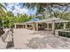 Spacious covered pavilion with stone pillars, benches, and a brick-paved area at 3727 Janus Way, Palm Harbor, FL 34685