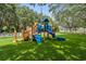 Community playground with fun climbing structures and a slide, perfect for families and children to play at 3727 Janus Way, Palm Harbor, FL 34685