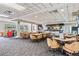 Inviting golf club restaurant with ample seating, a full bar, and TVs, ideal for relaxing and socializing at 3727 Janus Way, Palm Harbor, FL 34685