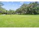 Community volleyball court on manicured lawn, perfect for outdoor recreation and social gatherings at 3727 Janus Way, Palm Harbor, FL 34685