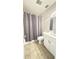 A bathroom featuring white vanity, toilet, and shower with curtain at 3829 S Lake Dr # 215, Tampa, FL 33614