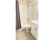 Bathroom featuring a shower and tub combo with a gray shower curtain, toilet and vanity at 3829 S Lake Dr # 215, Tampa, FL 33614
