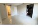A spacious bedroom features tile floors, walk-in closet and an attached bathroom at 3829 S Lake Dr # 215, Tampa, FL 33614