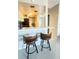 Bright eat-in kitchen featuring an island with seating and modern finishes at 3829 S Lake Dr # 215, Tampa, FL 33614