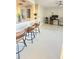 Open concept living area with counter seating and lots of natural light at 3829 S Lake Dr # 215, Tampa, FL 33614