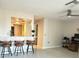 Open concept living area with barstool seating at 3829 S Lake Dr # 215, Tampa, FL 33614