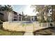 A gated community pool surrounded by lush greenery, providing a relaxing atmosphere at 3829 S Lake Dr # 215, Tampa, FL 33614