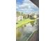 Peaceful water view from a screened window highlighting the community and waterway at 3829 S Lake Dr # 215, Tampa, FL 33614