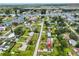 An aerial view of a residential neighborhood with waterfront access, featuring lush landscaping at 404 12Th Sw St, Ruskin, FL 33570
