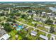 Aerial view of the neighborhood showcasing the waterway access and lush greenery around homes at 404 12Th Sw St, Ruskin, FL 33570