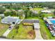 Aerial view of the property showing a well maintained yard, boat parking, and carport at 404 12Th Sw St, Ruskin, FL 33570