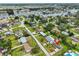 Scenic aerial view of a residential neighborhood with waterfront access and lush green landscaping throughout the community at 404 12Th Sw St, Ruskin, FL 33570
