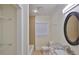 Bright bathroom with granite vanity, a tub, and window. Includes shelving for all your storage needs at 404 12Th Sw St, Ruskin, FL 33570